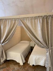 Postel nebo postele na pokoji v ubytování Agriturismo Pratofranco