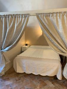 Postel nebo postele na pokoji v ubytování Agriturismo Pratofranco