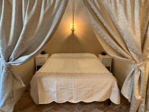Postel nebo postele na pokoji v ubytování Agriturismo Pratofranco