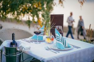 a table with two glasses of wine on it at Hotel Djerdap in Kladovo