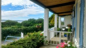 a porch with a view of the water at Rhins of Galloway in Cairnryan