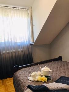 Rúm í herbergi á Apartman Jela