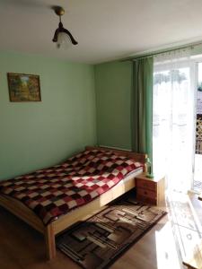 Posteľ alebo postele v izbe v ubytovaní Przystań Laworta