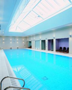 
a large swimming pool in a hotel room at Champneys Tring in Tring
