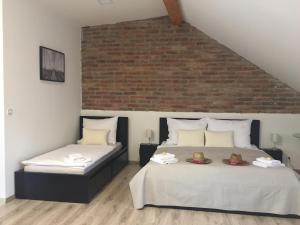 Ένα ή περισσότερα κρεβάτια σε δωμάτιο στο Penzion Lednice