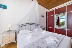 Postel nebo postele na pokoji v ubytování Apartment Riva