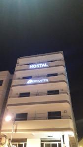 a hospital sign on the side of a building at Hostal Cervantes Playa in Garrucha
