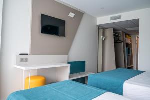 Кровать или кровати в номере Hotel Le Quetzal