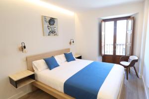 Postel nebo postele na pokoji v ubytování San Vicente Apartments
