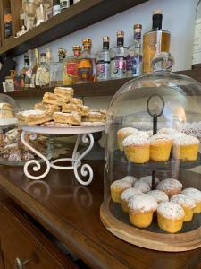 a display case with a bunch of donuts and pastries at Country house sant alfonso in Furore