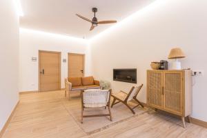 a living room with a couch and a table and chairs at GETARIA APARTAMENTUAK - Balentziaga in Getaria