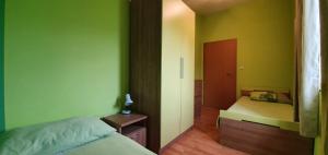 Postel nebo postele na pokoji v ubytování Apartmani Barbara App2