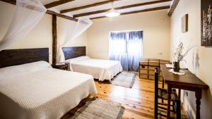 A bed or beds in a room at La Casa de la Estación