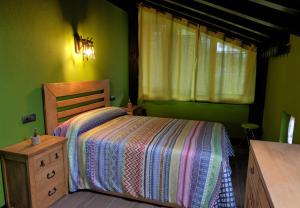 Un pat sau paturi într-o cameră la Bagadi