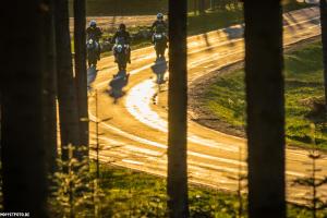 a group of people riding horses on a dirt road at Hotel Sassor in Battenberg