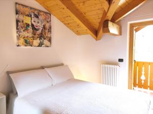 Ein Bett oder Betten in einem Zimmer der Unterkunft Casa Chiocciola CIPAT O22138-AT-O66928