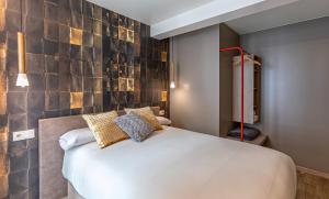 Postel nebo postele na pokoji v ubytování Apartamentos Pensua Sisargas