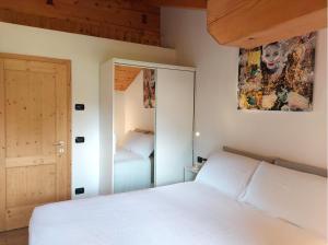 Ein Bett oder Betten in einem Zimmer der Unterkunft Casa Chiocciola CIPAT O22138-AT-O66928