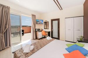 Postel nebo postele na pokoji v ubytování Mariblu Hotel