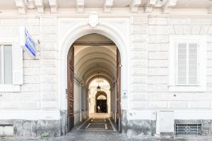 an entrance to a building with an archway at Lux Caracciolo in Naples