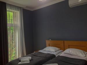 Un pat sau paturi într-o cameră la Guest House Maradona