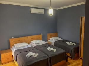 Ένα ή περισσότερα κρεβάτια σε δωμάτιο στο Guest House Maradona