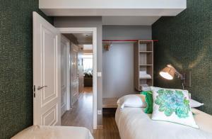 Postel nebo postele na pokoji v ubytování Apartamentos Pensua Sisargas