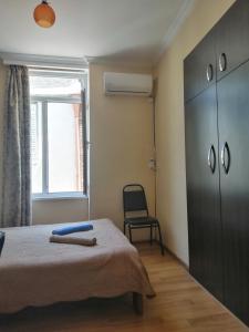 Postel nebo postele na pokoji v ubytování Guest House Monshishi
