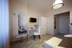 TV a/nebo společenská místnost v ubytování Piccolo Hotel Allamano