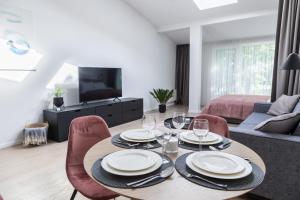 TV a/nebo společenská místnost v ubytování Apartment Hotel Laisve