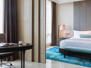 Letto o letti in una camera di Raffles Jakarta