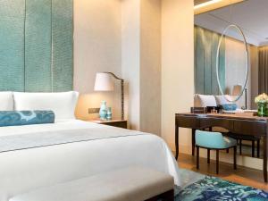 Letto o letti in una camera di Raffles Jakarta