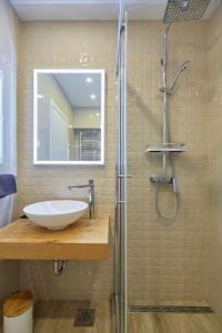 a bathroom with a sink and a shower at Apartments Silva in Dubrovnik +36 photos