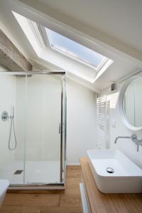 a bathroom with a shower and a sink at Mato Apartment Torino in Turin