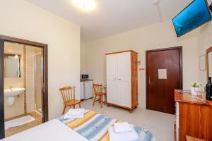 TV a/nebo společenská místnost v ubytování Mariblu Hotel