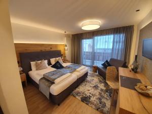 Postel nebo postele na pokoji v ubytování Garni Hotel Mezdi