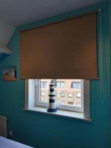 TV i/ili multimedijalni sistem u objektu Appartement De Panne Zonneblik