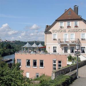 a building with people sitting on top of it at Schöne Aussicht in Bad Friedrichshall