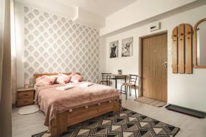 Posteľ alebo postele v izbe v ubytovaní ZAKOHOME- Apartamenty Kościelisko Centrum