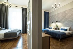 Łóżko lub łóżka w pokoju w obiekcie Bentis Luxury Apartments