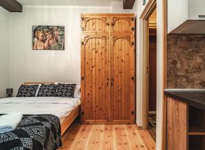 Posteľ alebo postele v izbe v ubytovaní ZAKOHOME- Apartamenty Kościelisko Centrum