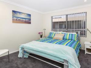 A bed or beds in a room at Rosebank On Terralong