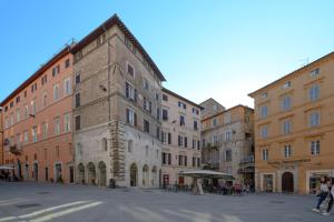 a group of buildings on a street in a city at Monolocale su Corso Vannucci 2+2 in Perugia