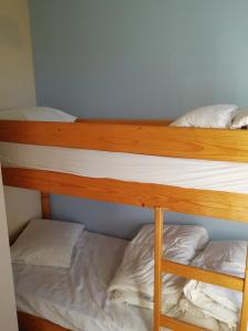 a couple of bunk beds in a room at Bella Plaza in De Panne