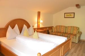 Postel nebo postele na pokoji v ubytování Hotel Karin