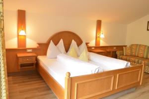 Postel nebo postele na pokoji v ubytování Hotel Karin