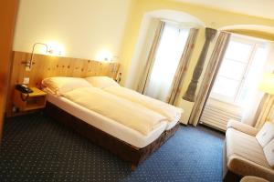 Postel nebo postele na pokoji v ubytování Ambiente Hotel Freieck