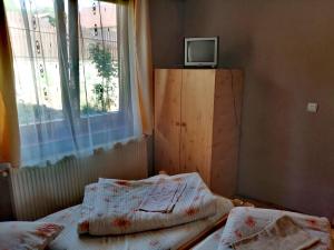 Postel nebo postele na pokoji v ubytování Sóhegy Panzió