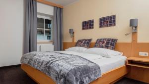 Posteľ alebo postele v izbe v ubytovaní Haus Veronika - Appartements by Miha