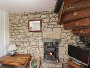 A television and/or entertainment center at Athelstan Cottage 